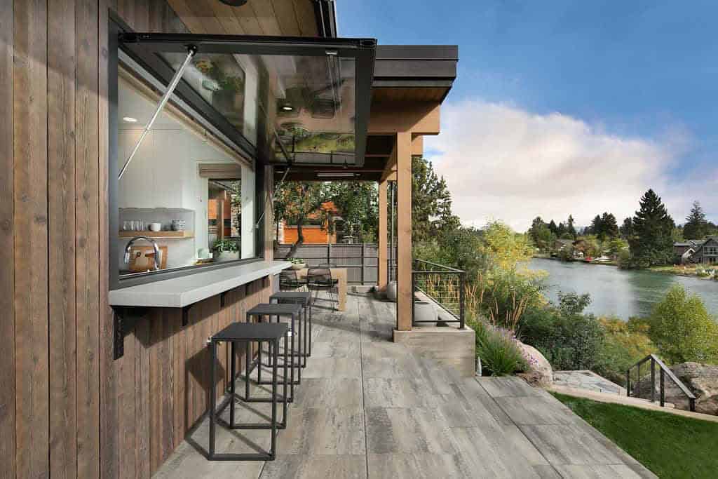 modern-home-exterior-pass-through-window-with-a-bar-countertop-and-outdoor-deck