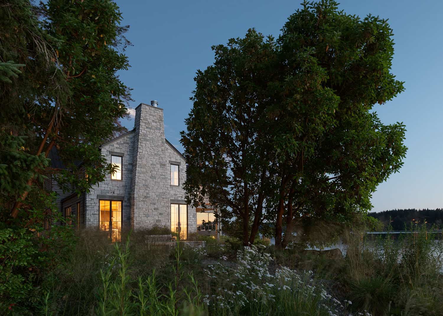 english-cotswolds-inspired-home-exterior-at-dusk