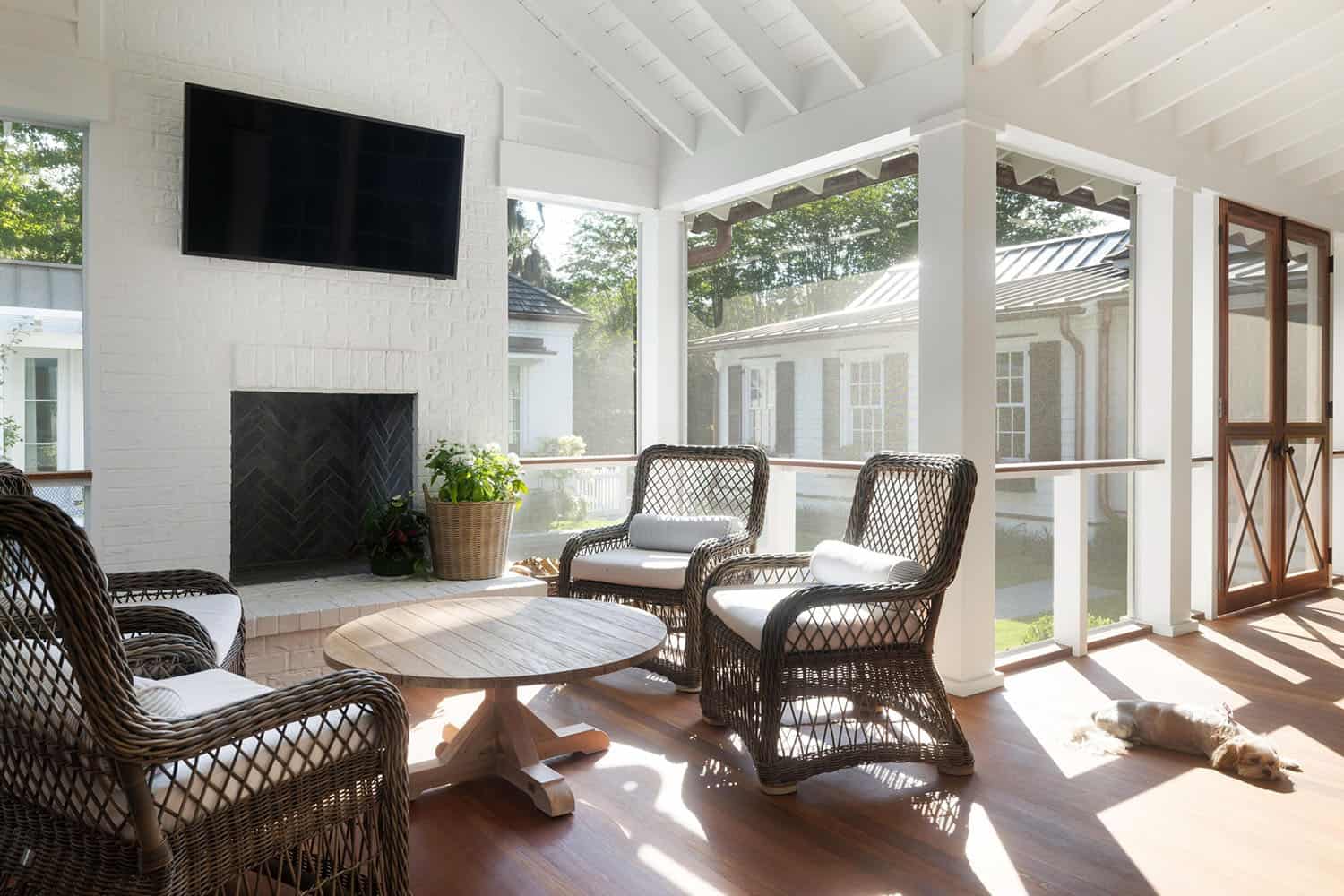 transitional-style-screen-porch-with-a-fireplace