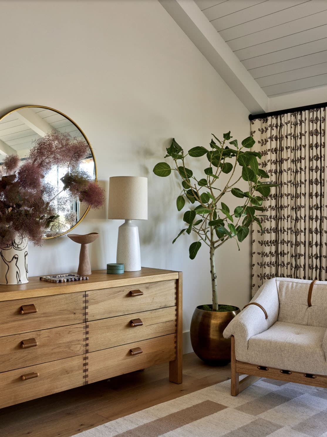 beach-style-bedroom-with-a-dresser-and-chair