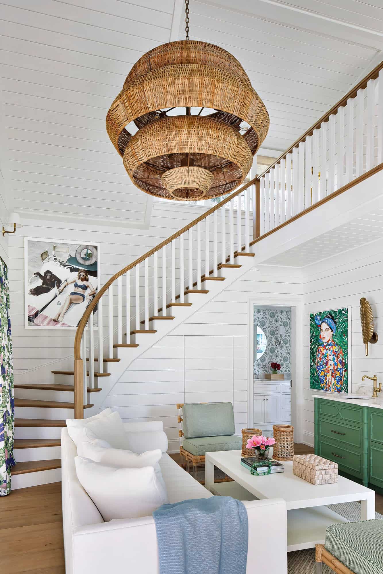 coastal-style-family-room-with-a-curved-staircase