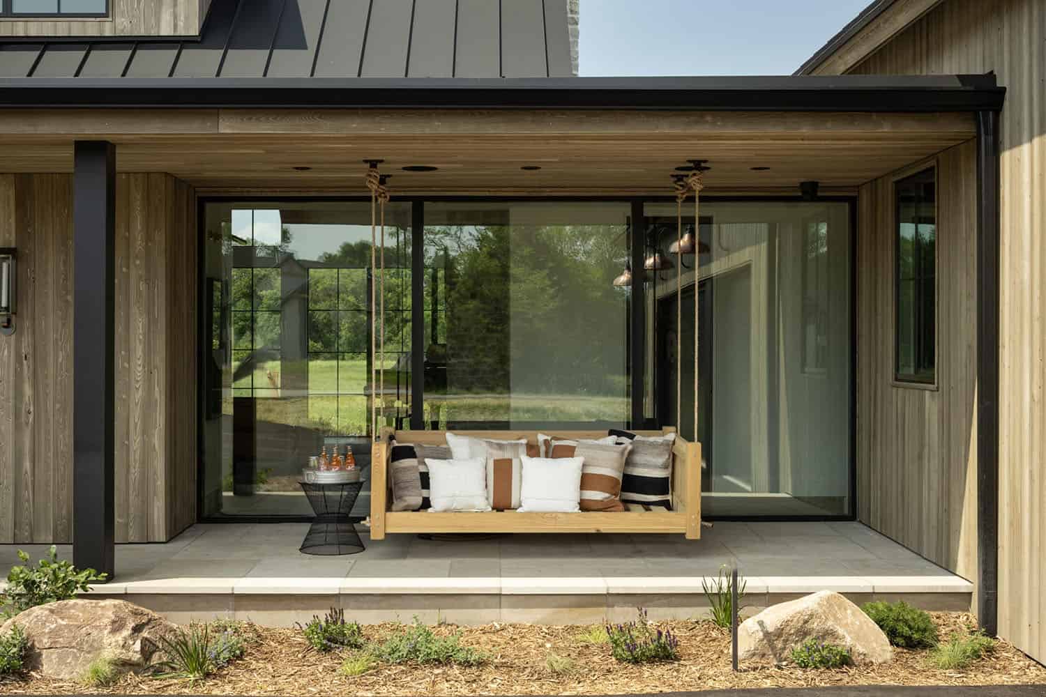 modern-home-exterior-with-a-covered-porch-and-hanging-chair