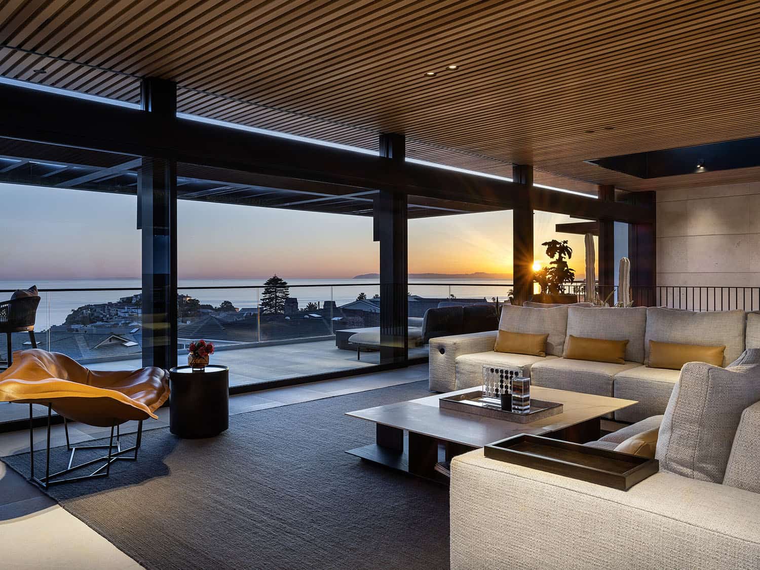 modern-living-room-with-indoor-outdoor-living-at dusk