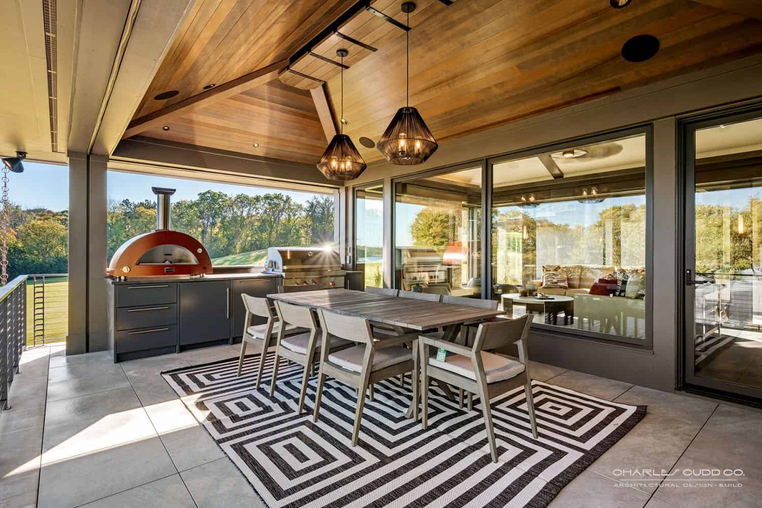 modern-screened-porch-with-alfresco-dining-and-a-grill