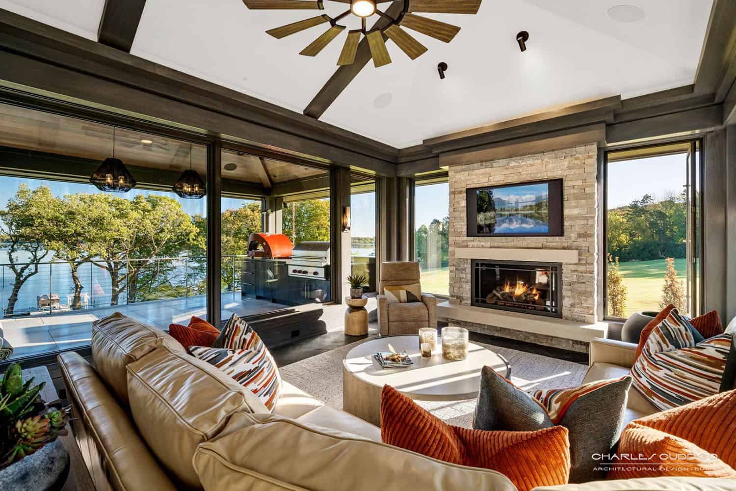 modern-screened-porch-with-outdoor-furniture-and-a-fireplace