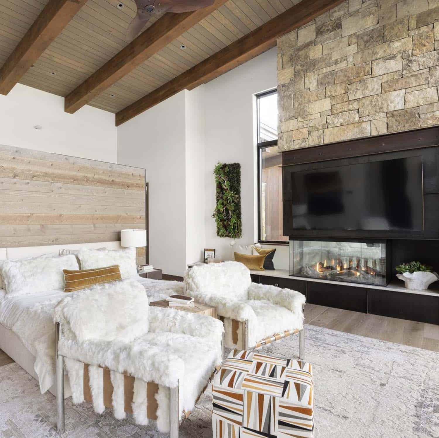 modern-rustic-bedroom-with-a-fireplace