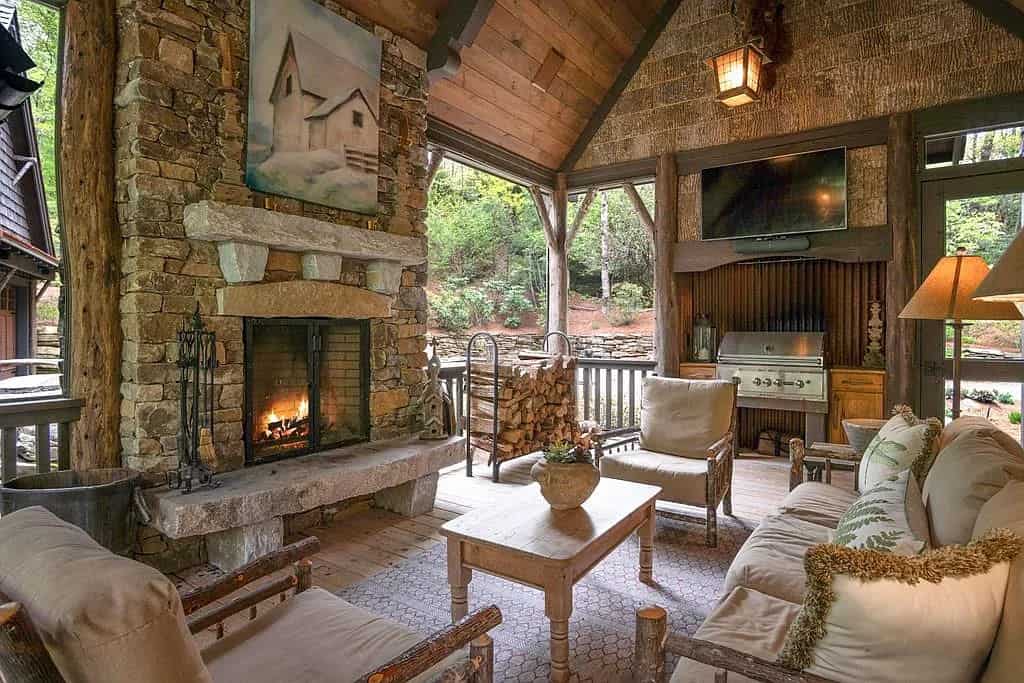 modern-rustic-covered-porch-with-outdoor-furniture-and-a-fireplace