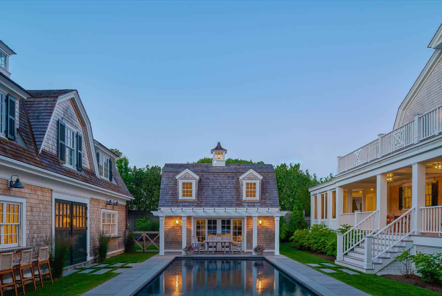 shingle-style-pool-house-exterior-with-a-pool