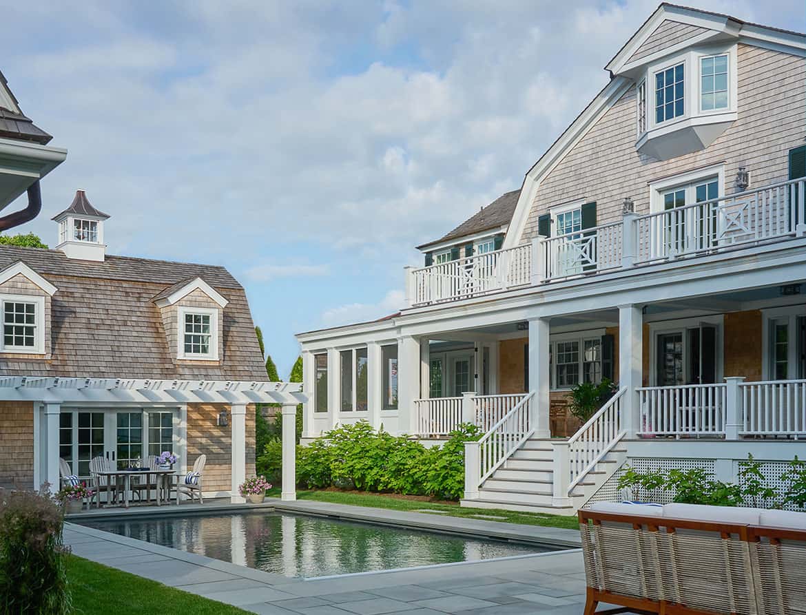 shingle-style-beach-house-exterior-with-a-pool