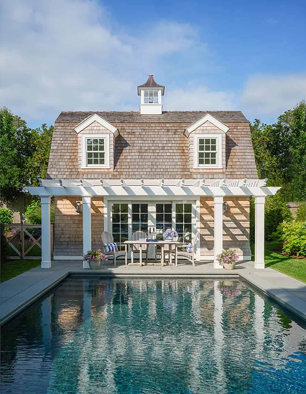 shingle-style-beach-house-exterior-with-a-pool