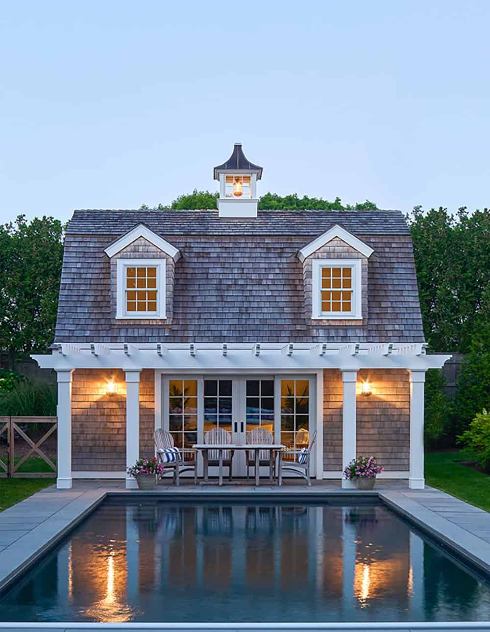 shingle-style-beach-house-exterior-with-a-pool