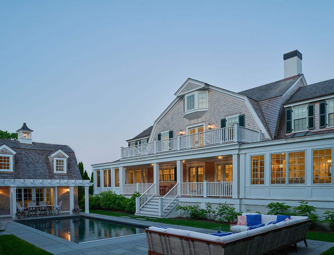 shingle-style-beach-house-exterior-with-a-pool