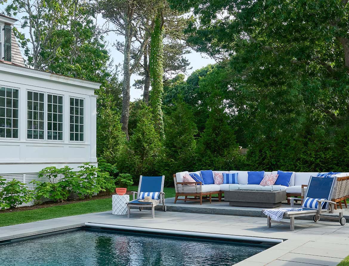 shingle-style-beach-house-exterior-with-a-pool