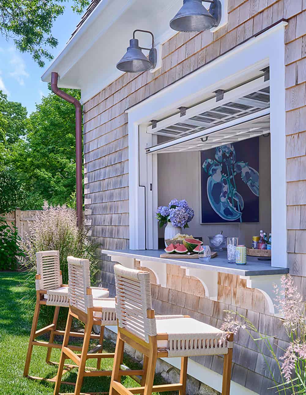 shingle-style-beach-house-exterior-with-a-pass-through-window-and-bar