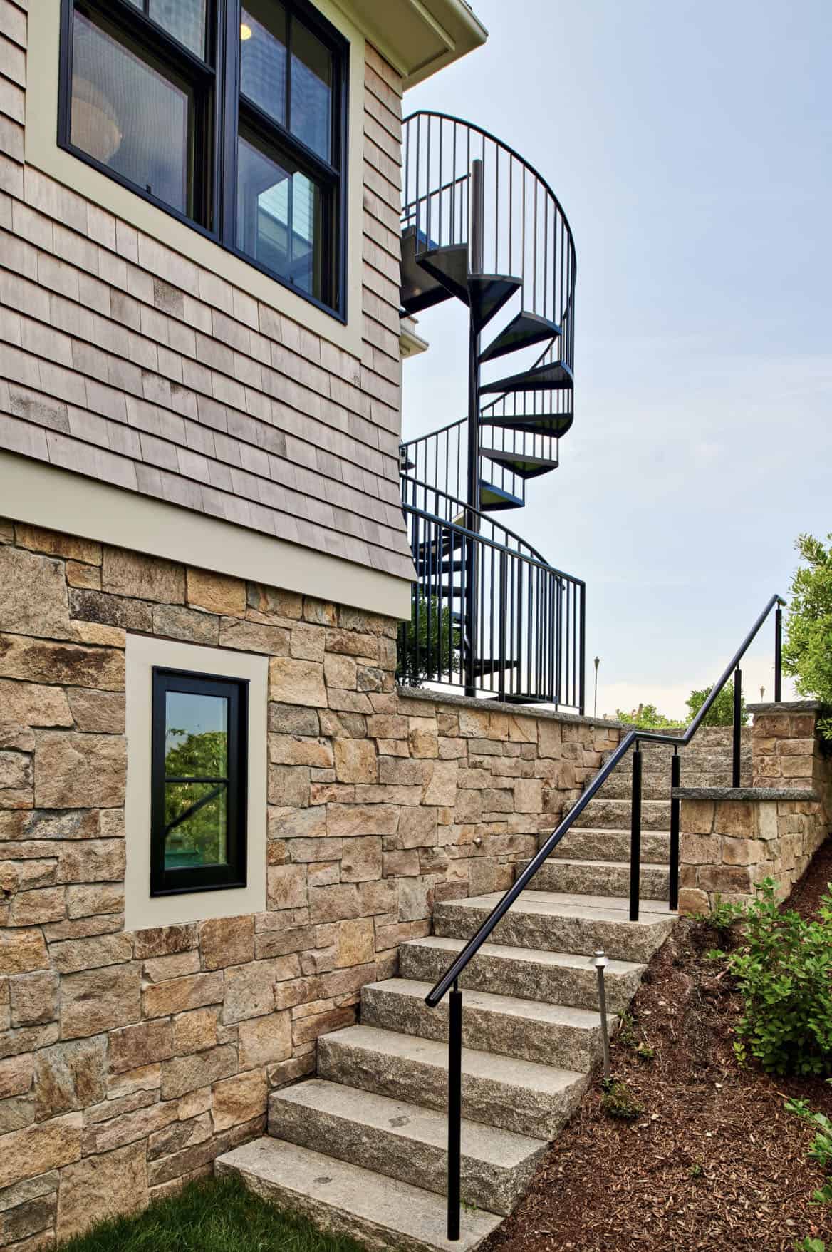 shingle-style-waterfront-house-exterior-with-a-staircase