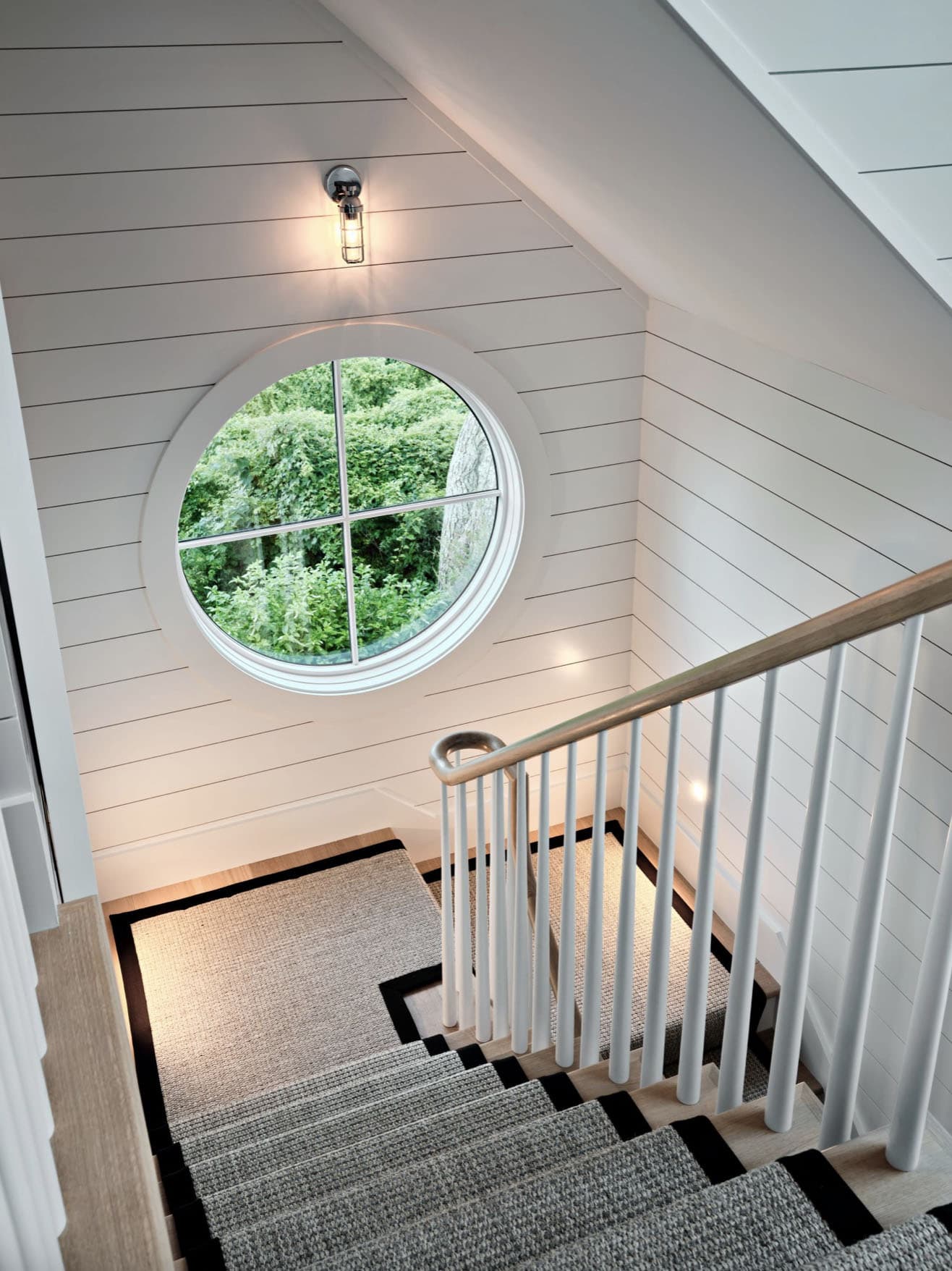 beach-style-staircase-with-a-round-window