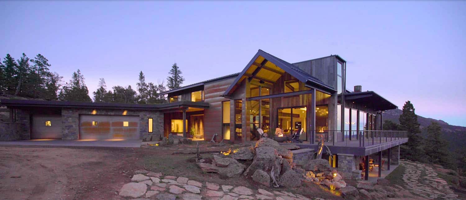 contemporary mountain home exterior at dusk