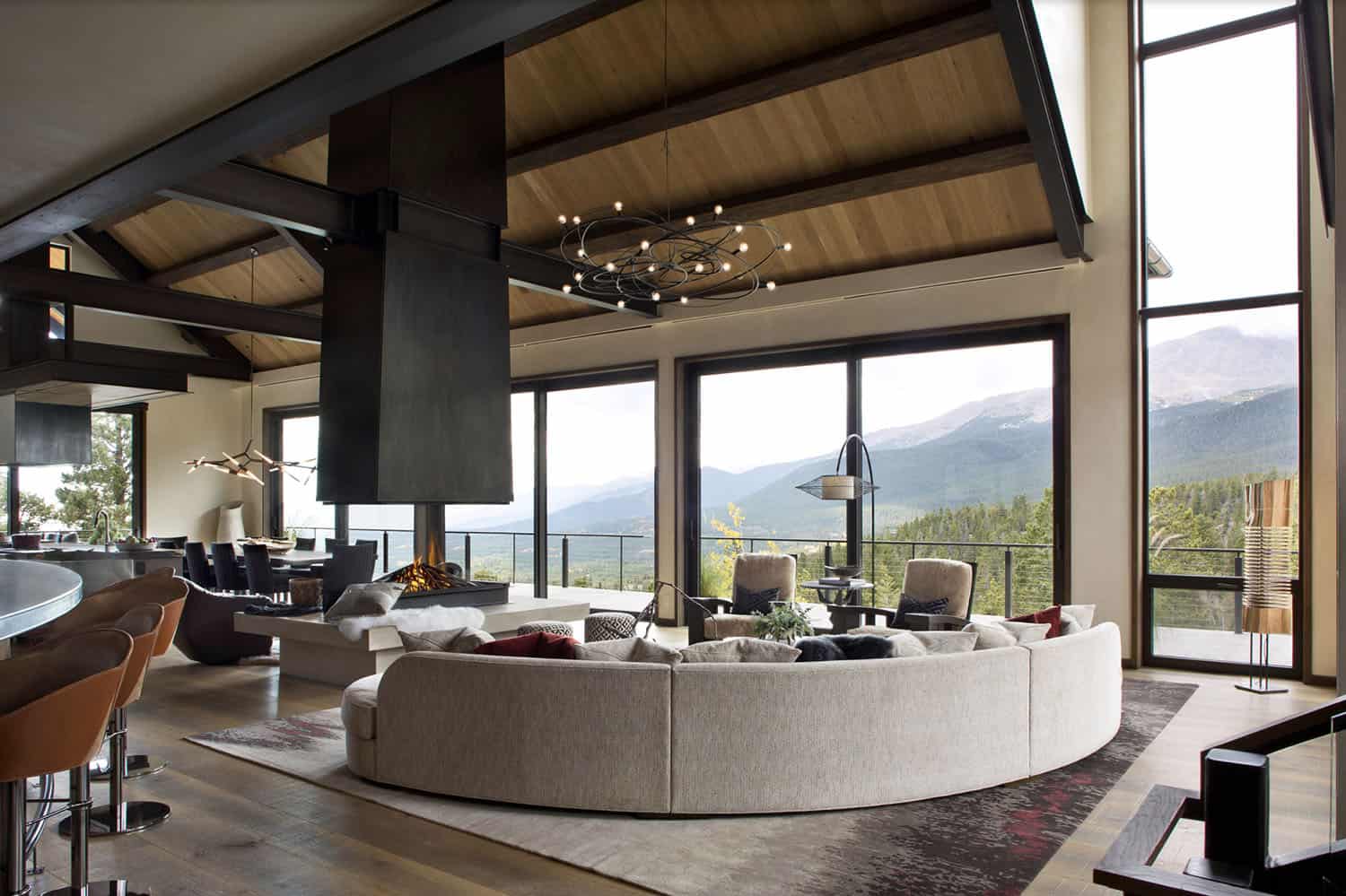 contemporary living room with a fireplace suspended from the ceiling