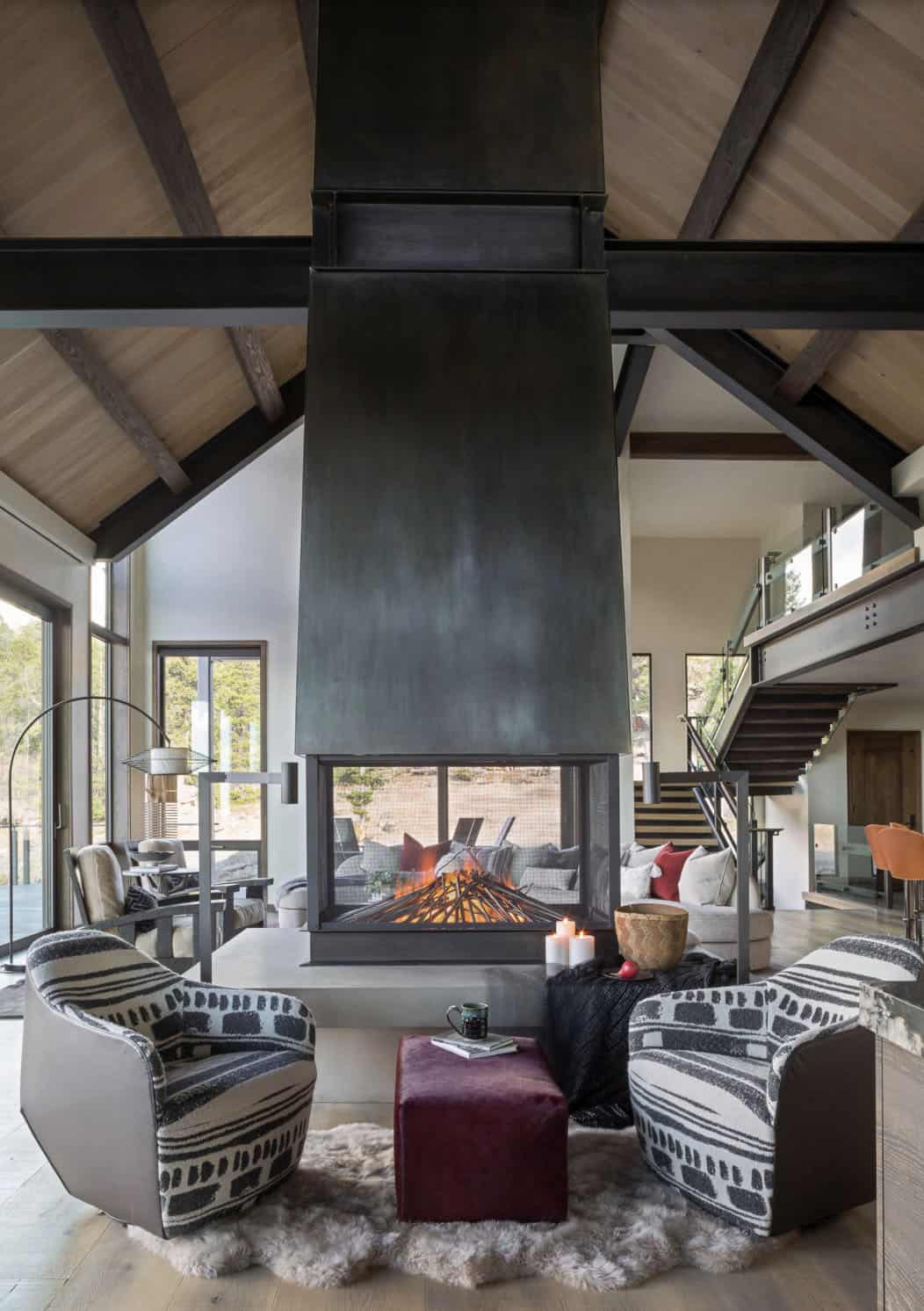 contemporary living room with a dual-sided fireplace