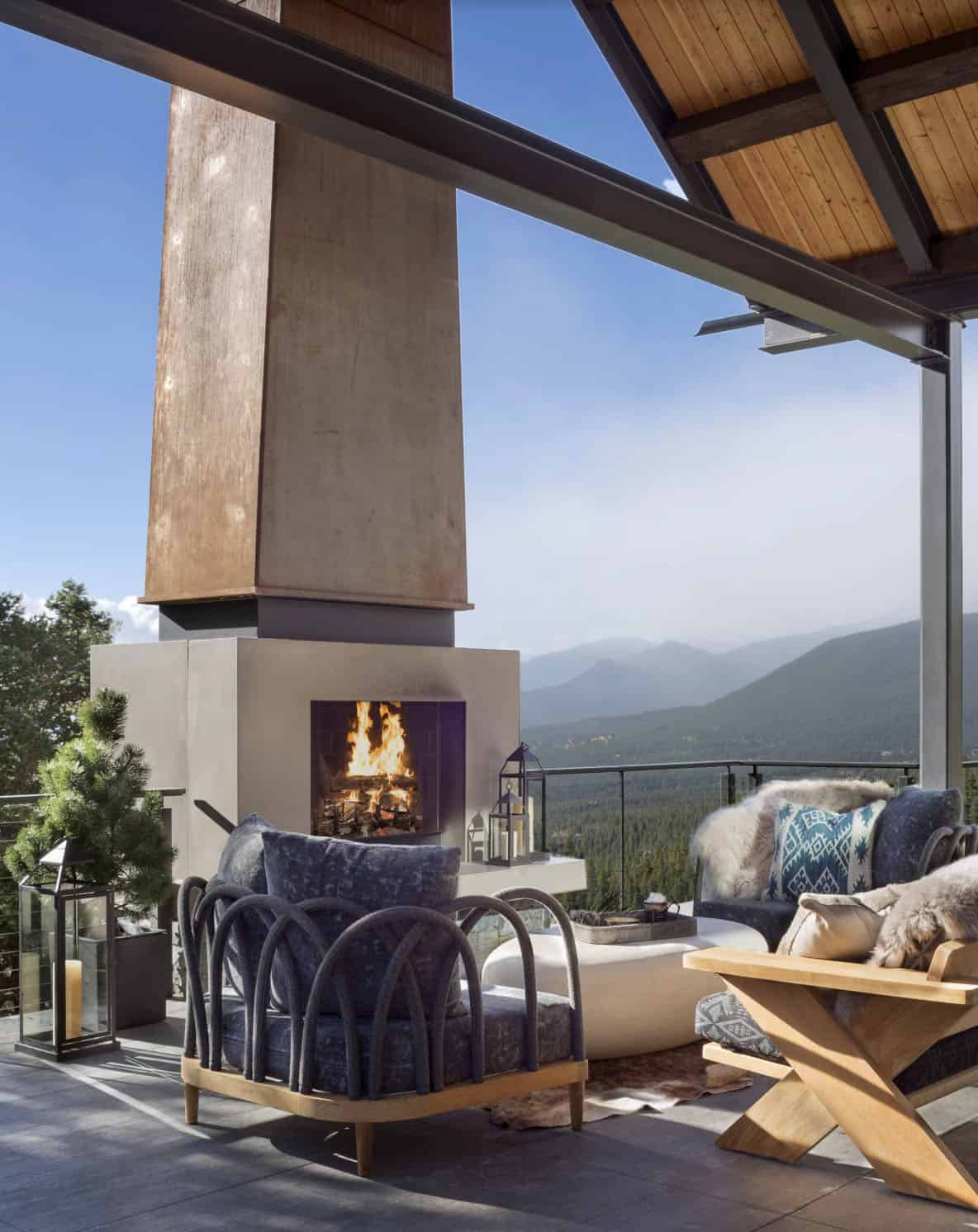contemporary covered patio with a fireplace and outdoor furniture