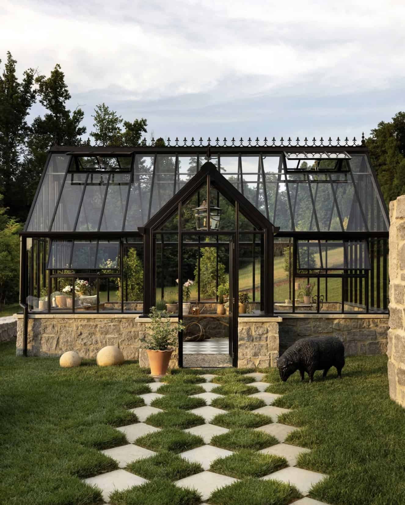 greenhouse exterior with paver and grass pathway