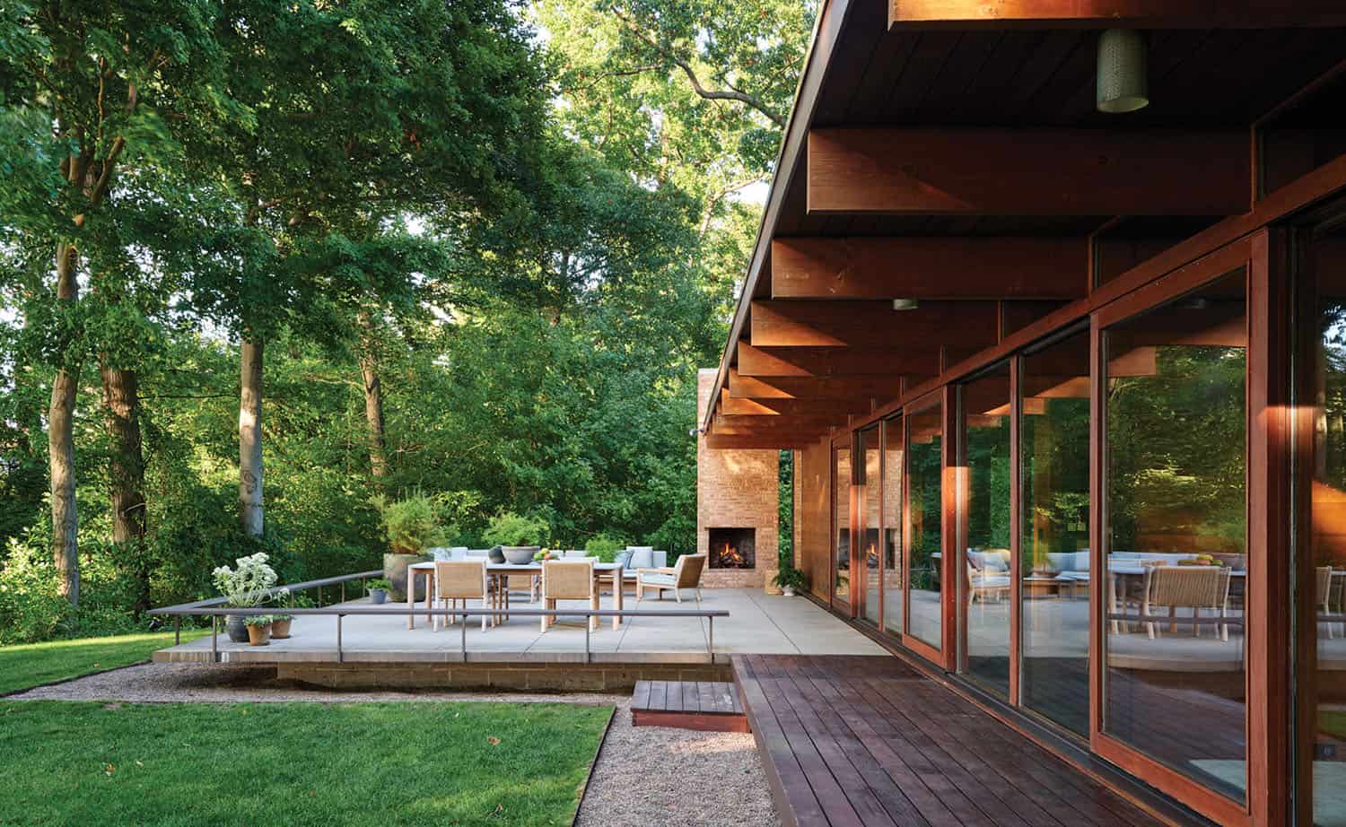 lakeside midcentury home exterior with a patio