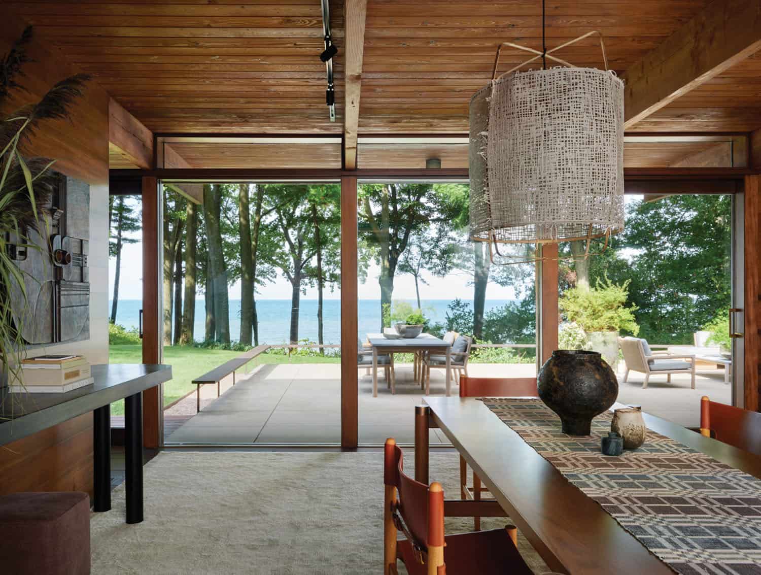 midcentury modern dining room with a window view of the lake