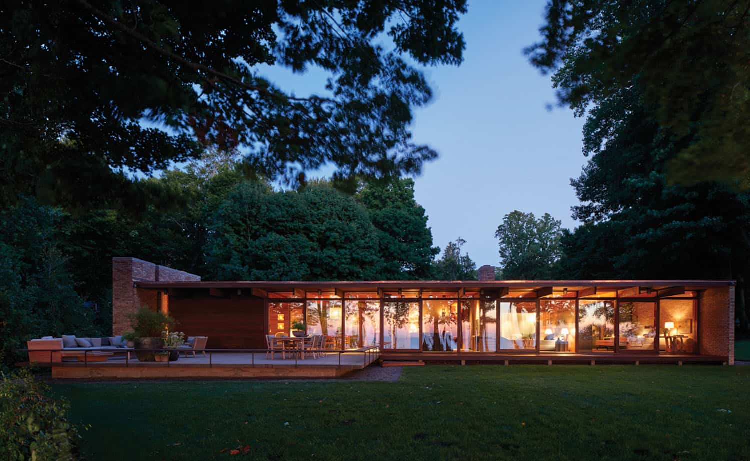 midcentury modern home exterior at dusk