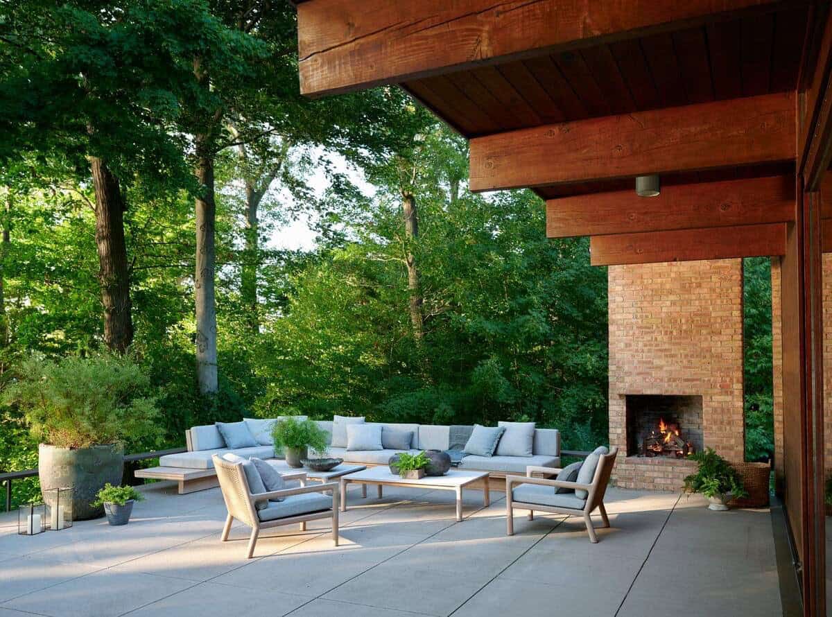 midcentury modern patio with a fireplace and outdoor furniture