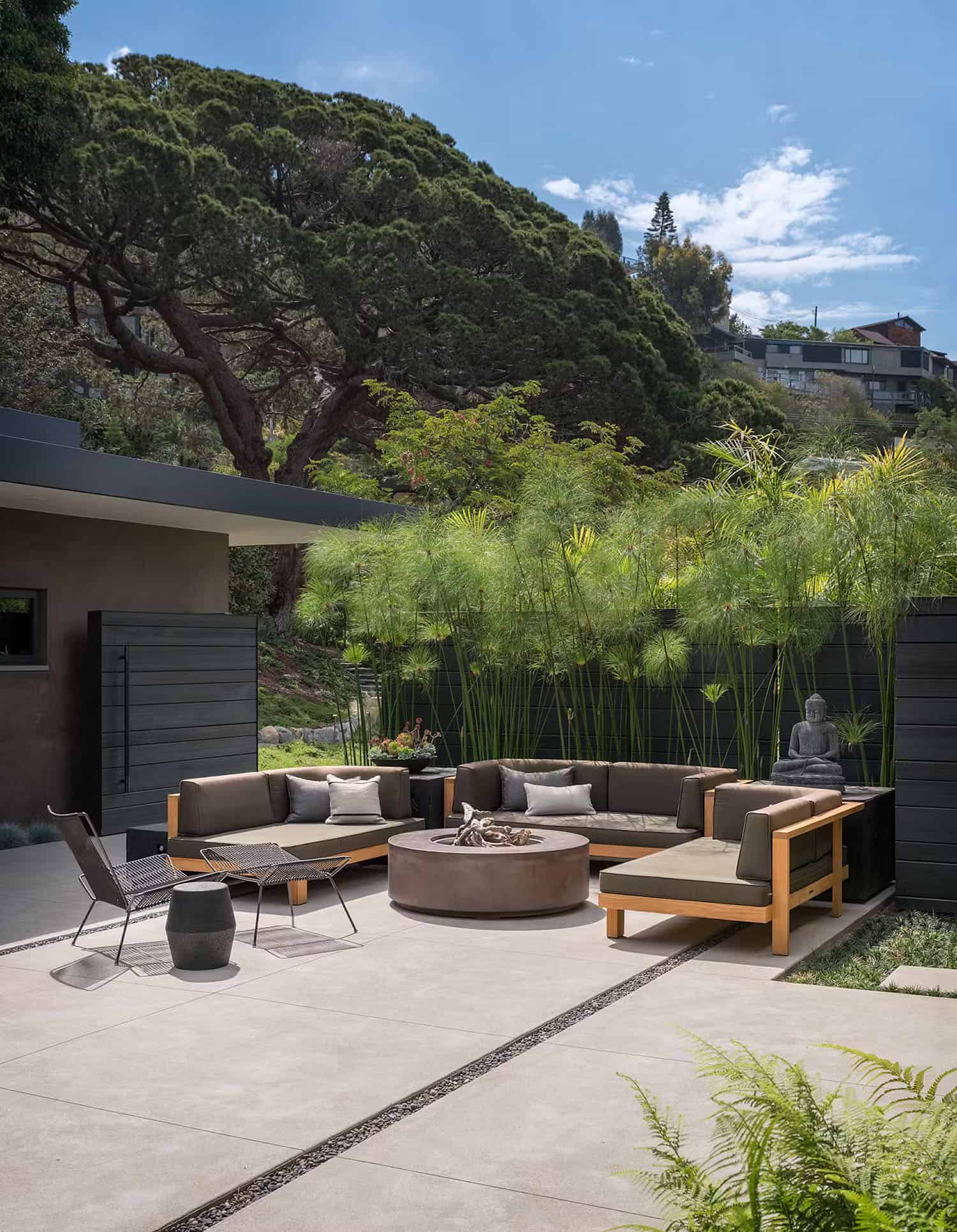 midcentury modern house exterior with a courtyard and outdoor furniture