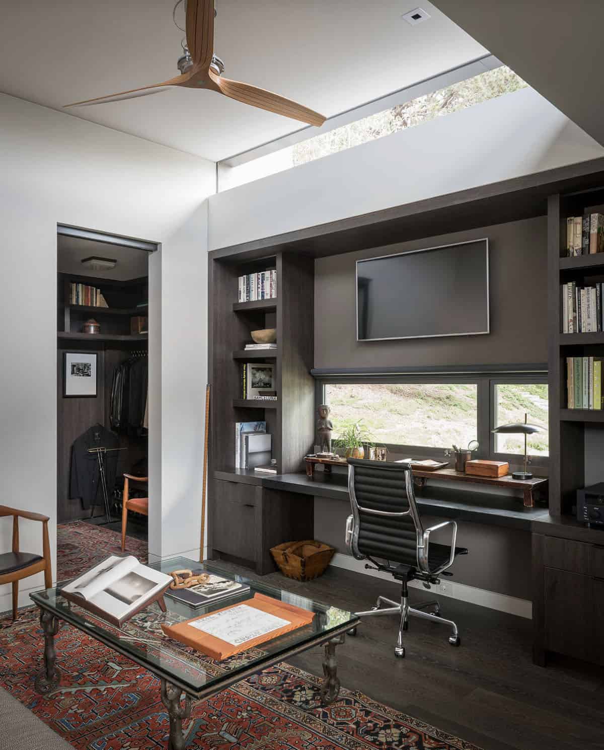 midcentury modern home offie with built-in cabinets and bookshelves