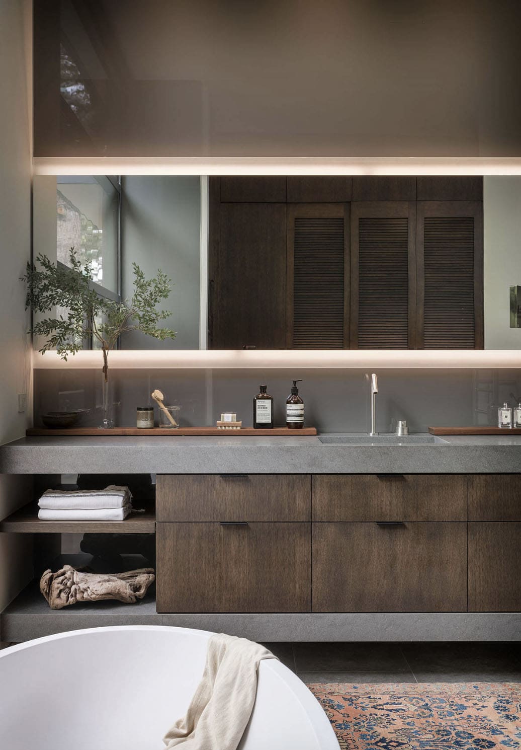 midcentury modern bathroom vanity with a concrete countertop