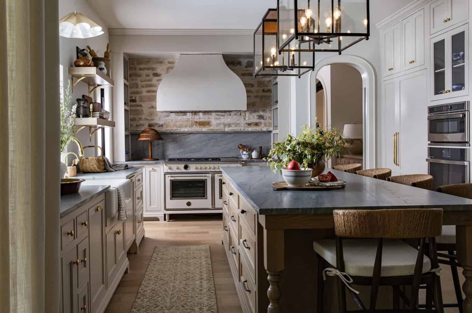 contemporary island kitchen with large pendant lights