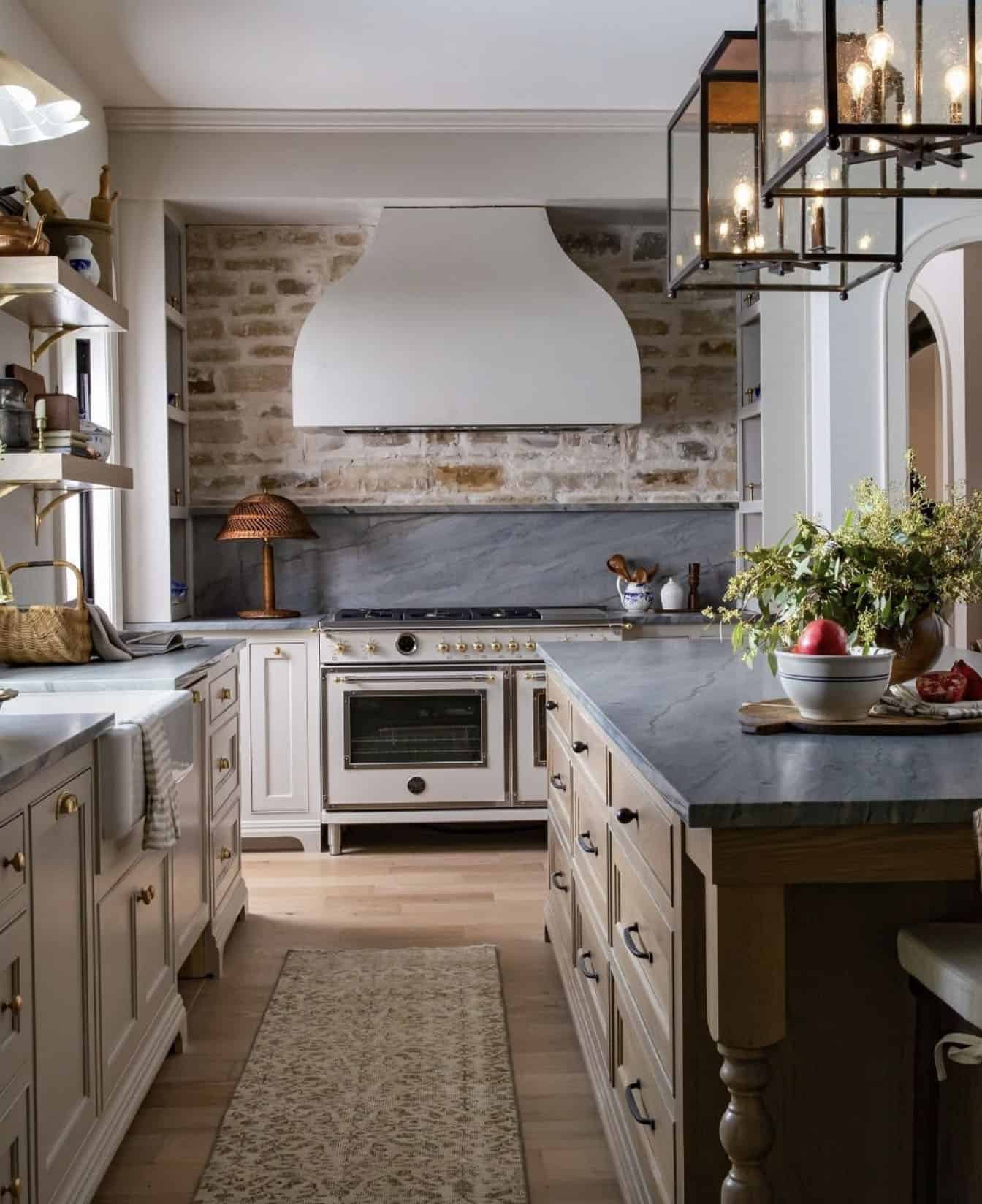 contemporary island kitchen with large pendant lights