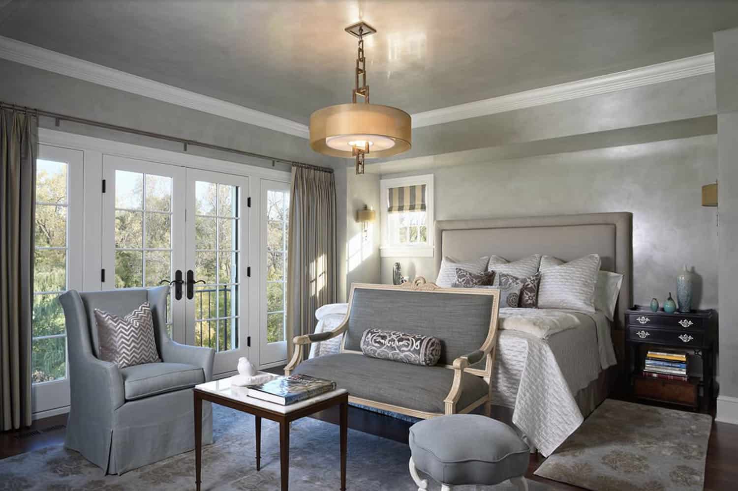 victorian style bedroom with french doors leading out to a Juliet balcony