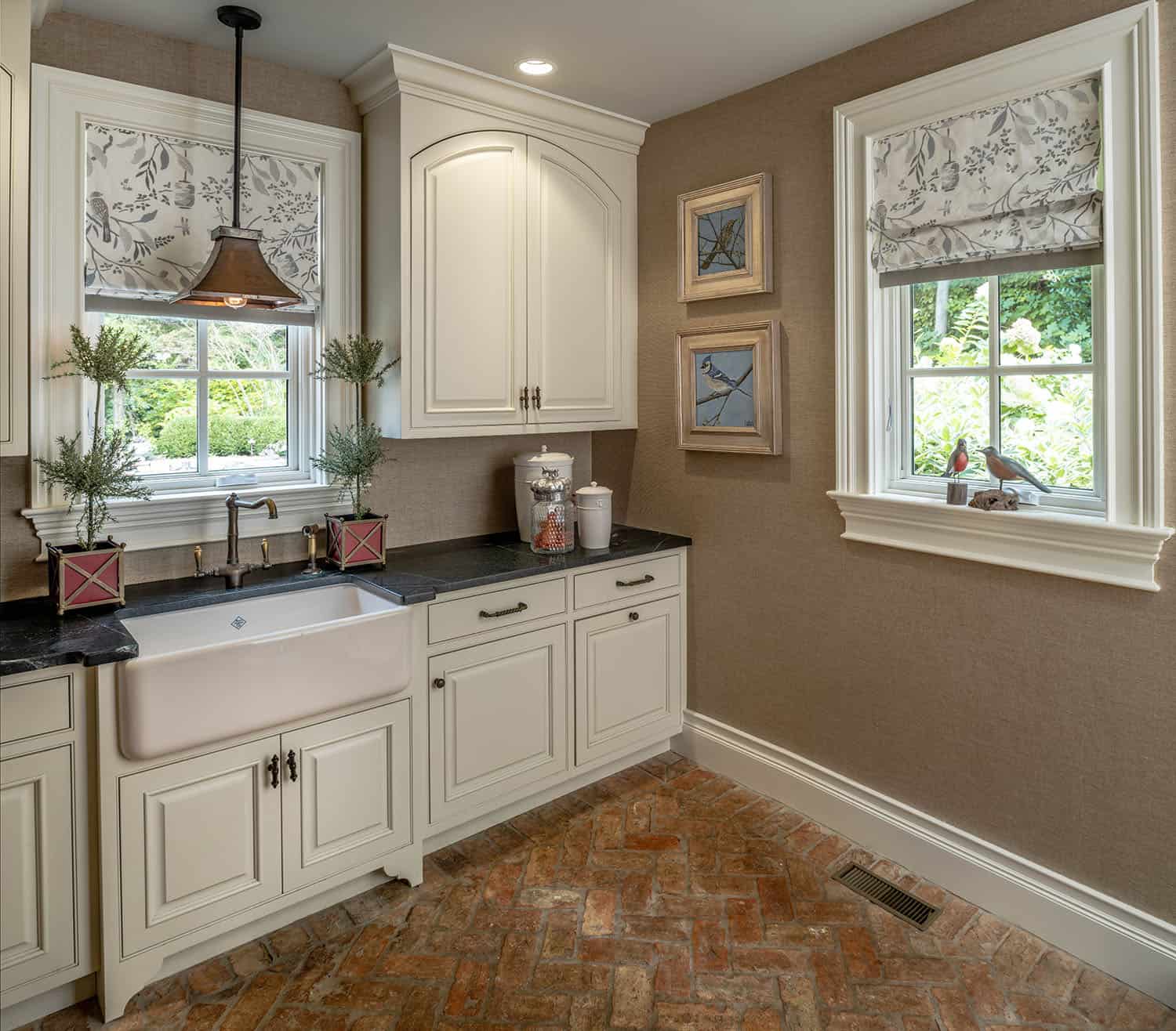 traditional laundry room with a farmhouse sink