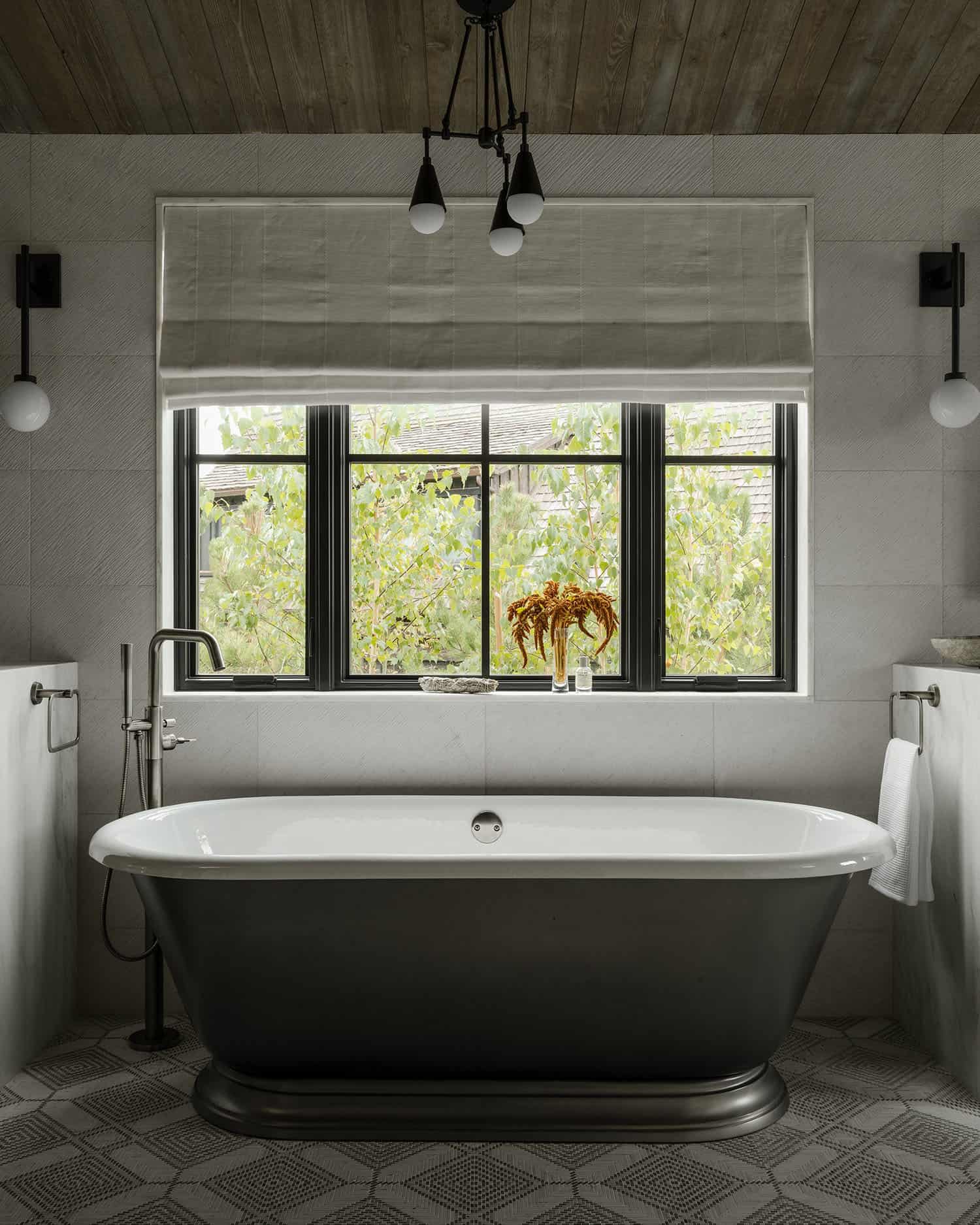 transitional style bathroom with a freestanding tub