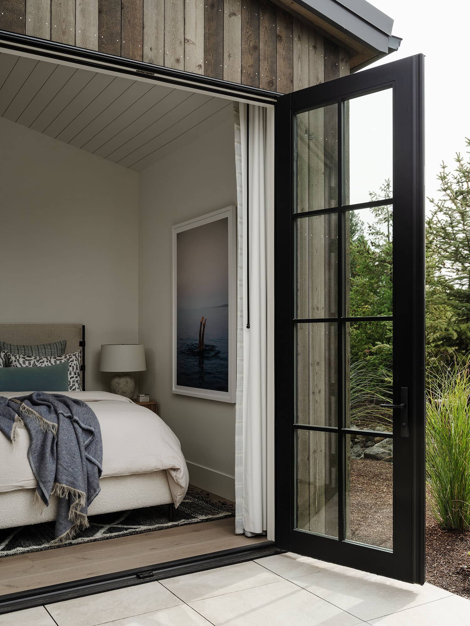 transitional style bedroom with french doors