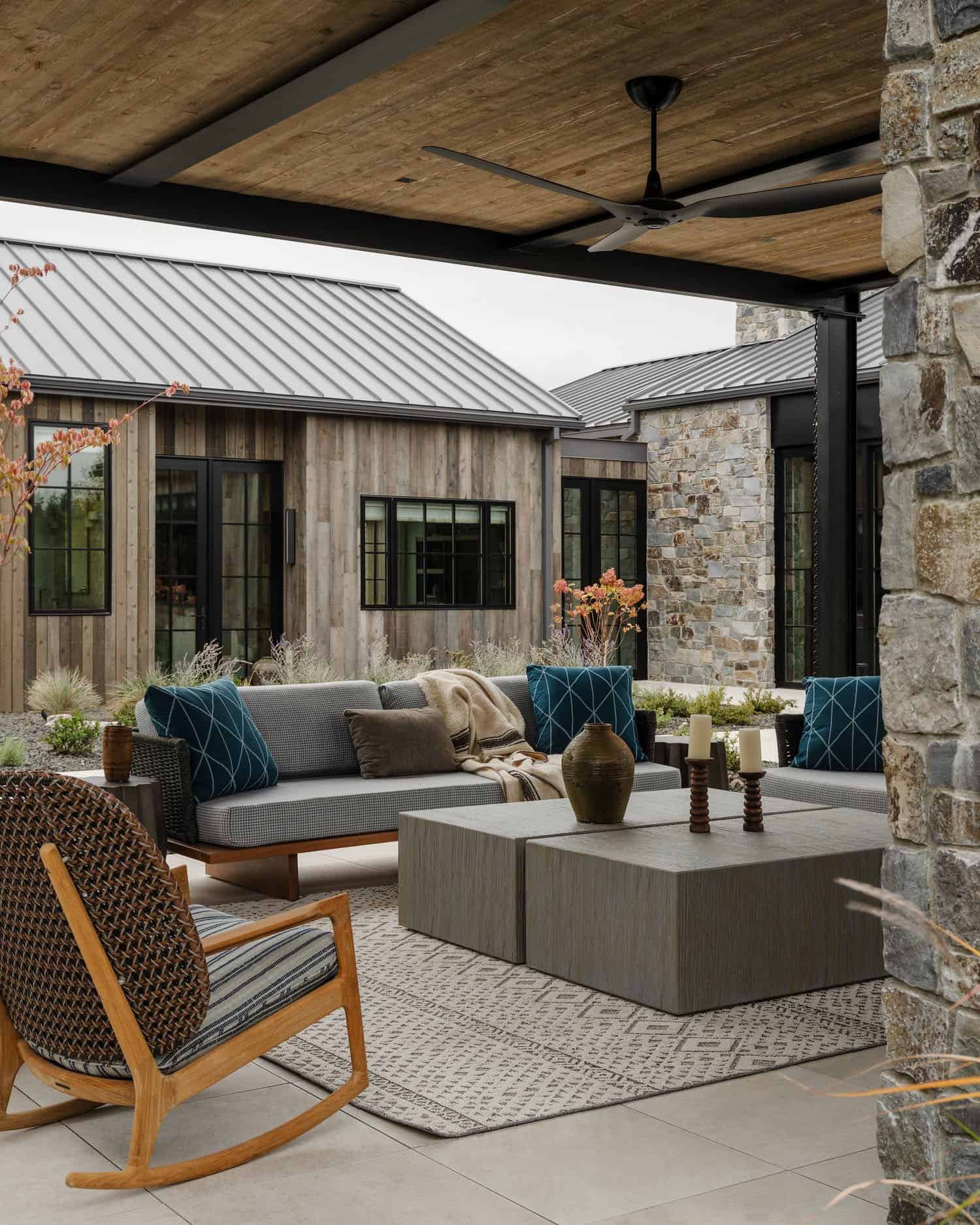 rustic modern home with a covered patio with outdoor furniture