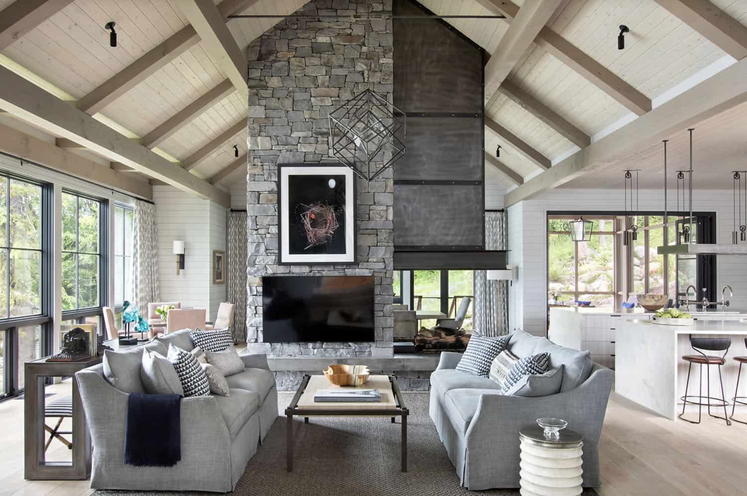 rustic modern living room with a steel three-sided fireplace