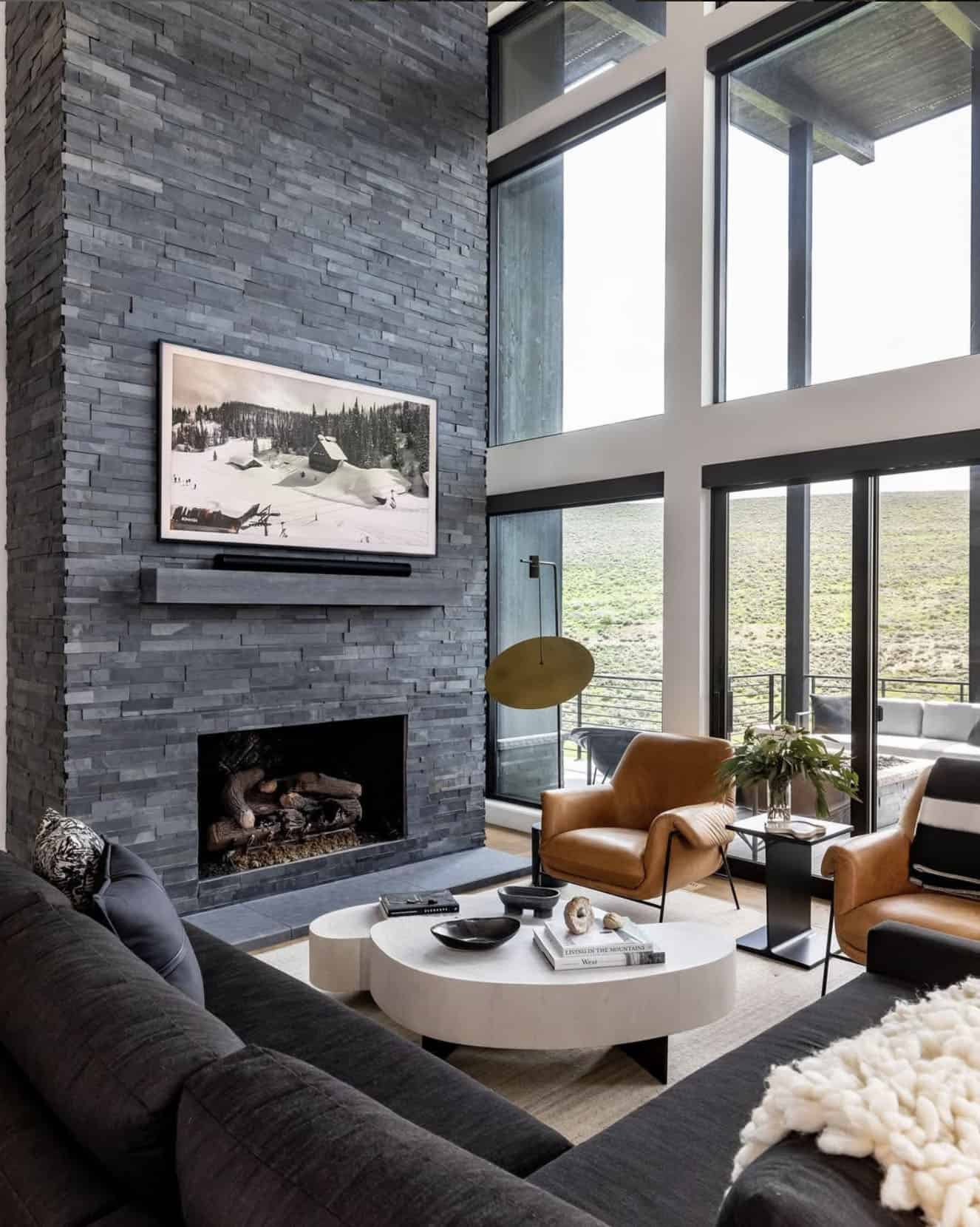 modern rustic living room with a sleek fireplace and large windows