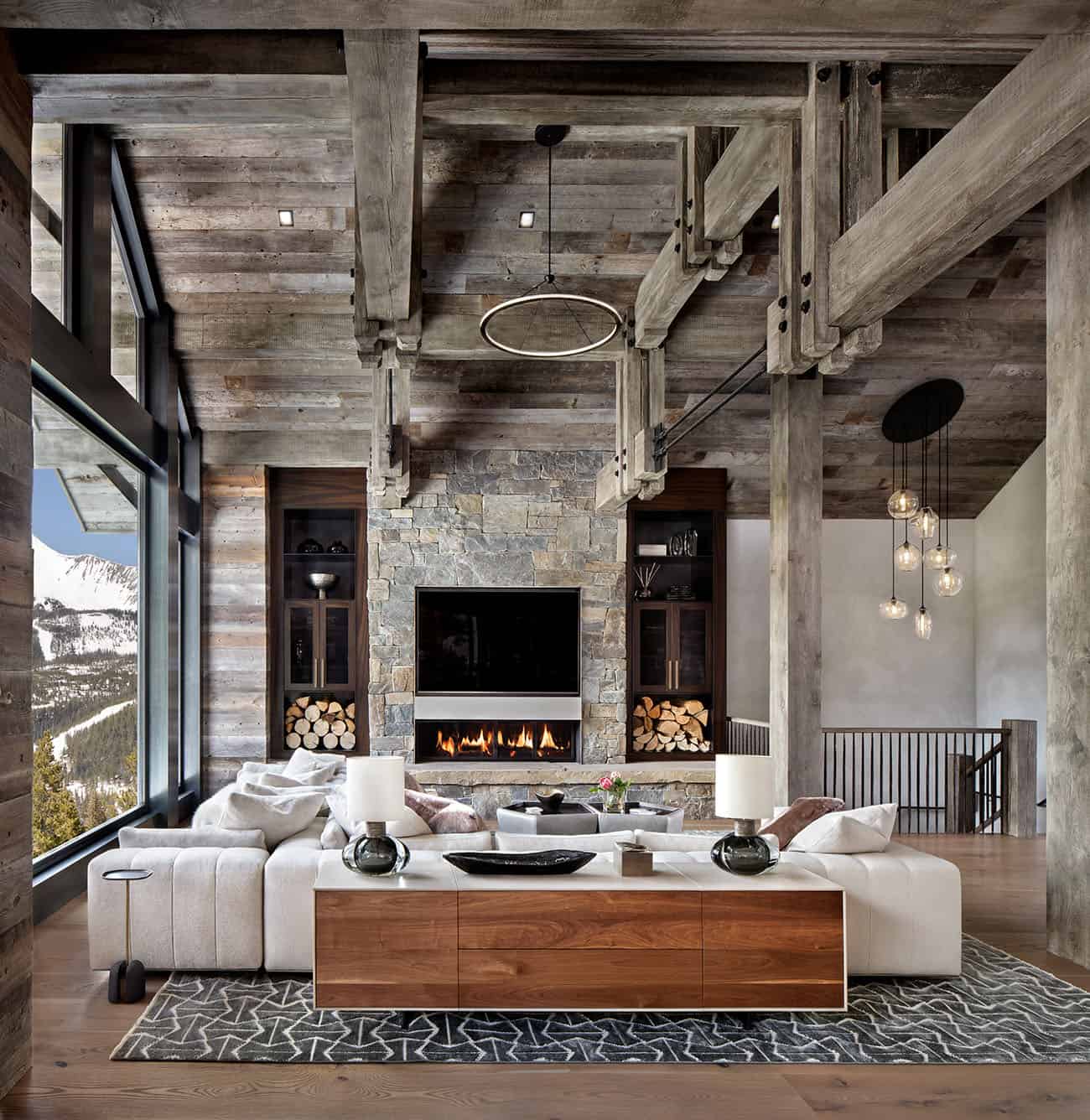 rustic modern living room with high ceilings and wood trusses