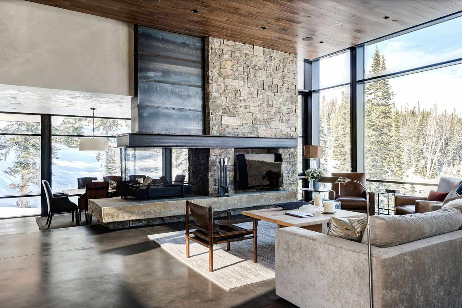 rustic modern living room with a dual-sided fireplace