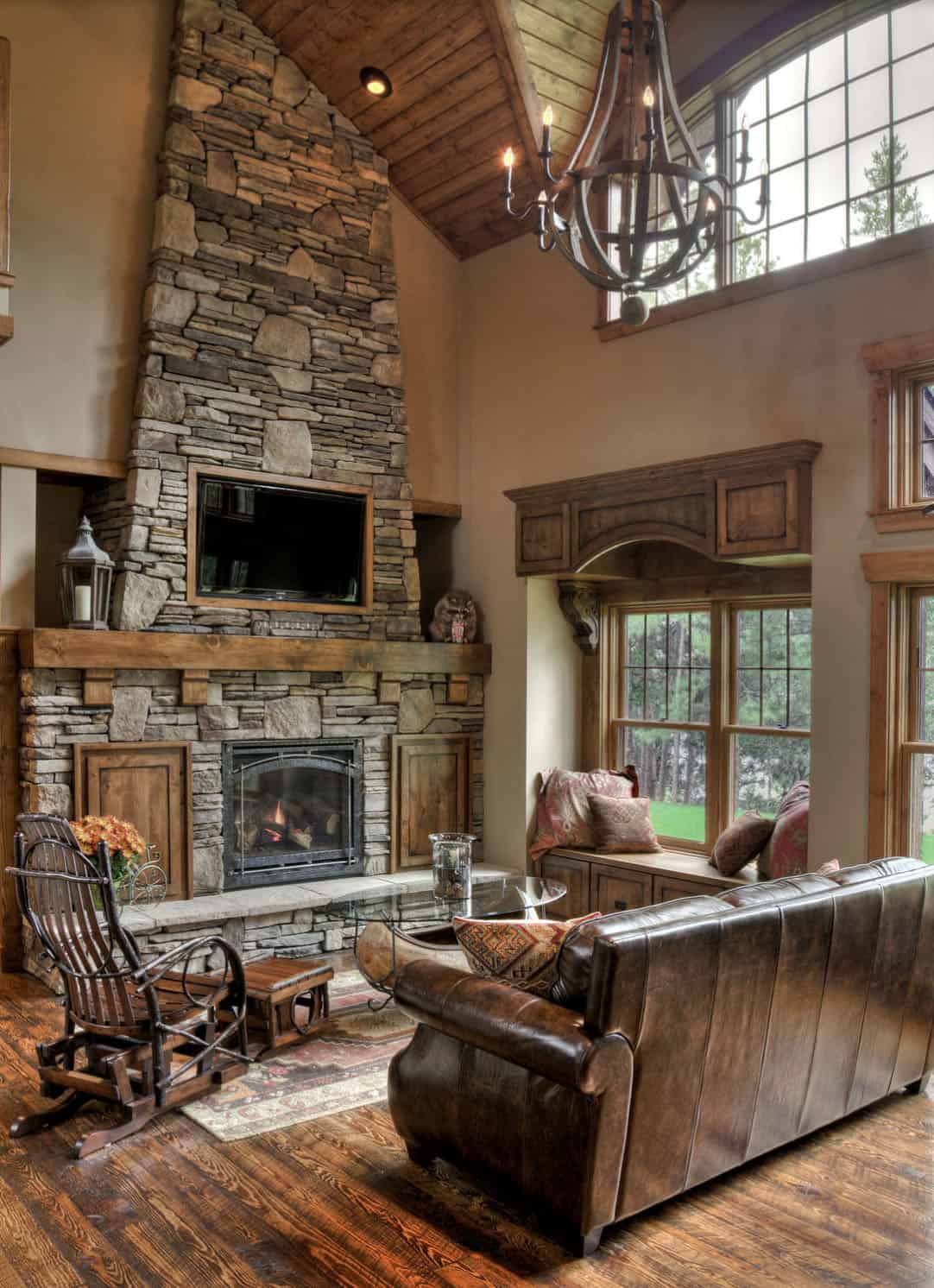 rustic modern living room with a floor-to-ceiling stone-clad fireplace