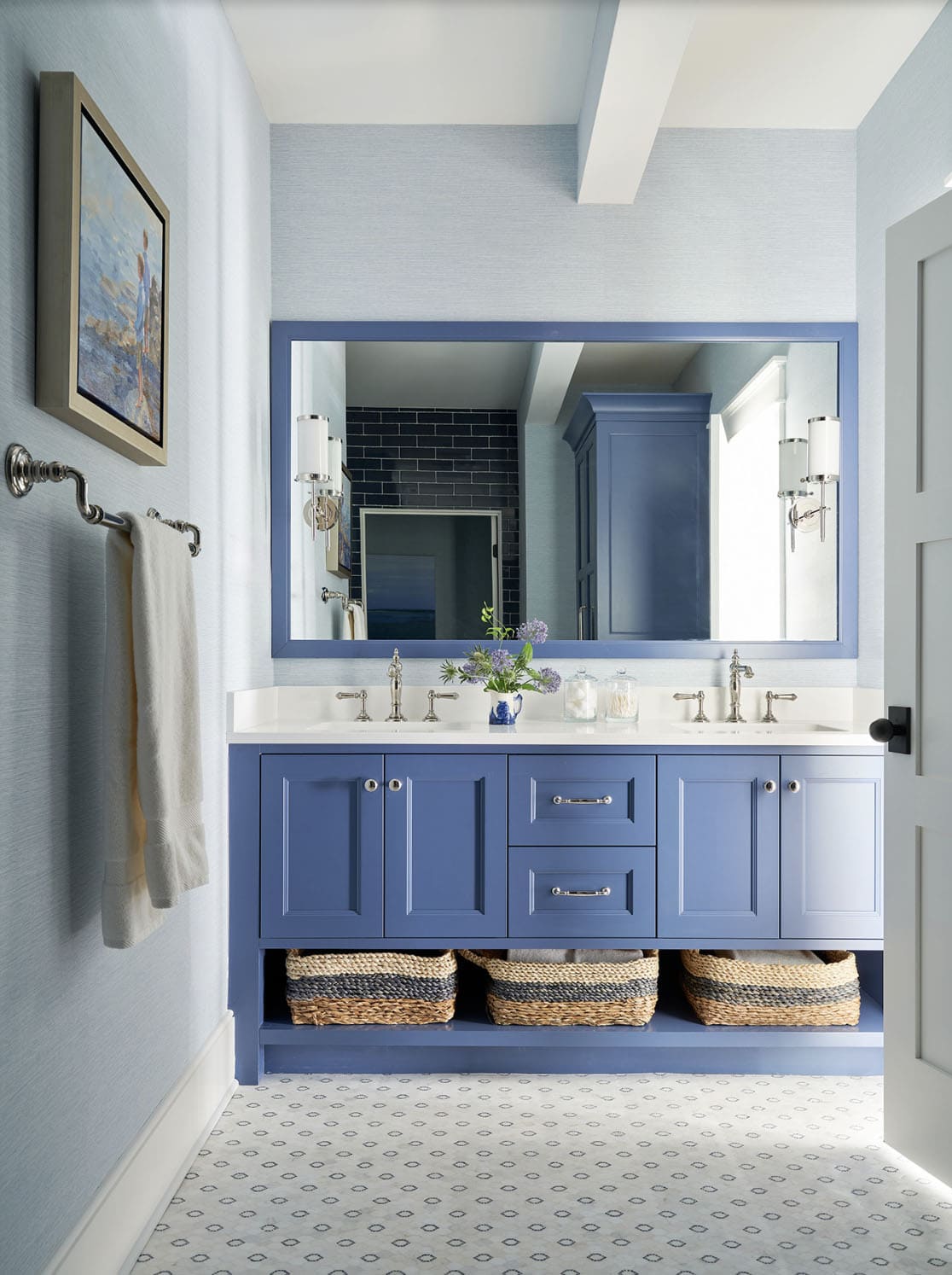 beach style bathrom with a blue vanity