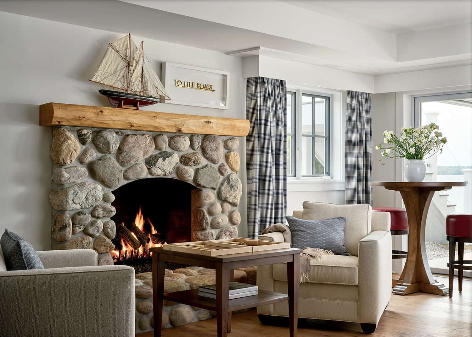 lower level fireplace area for playing games and enjoying lake views