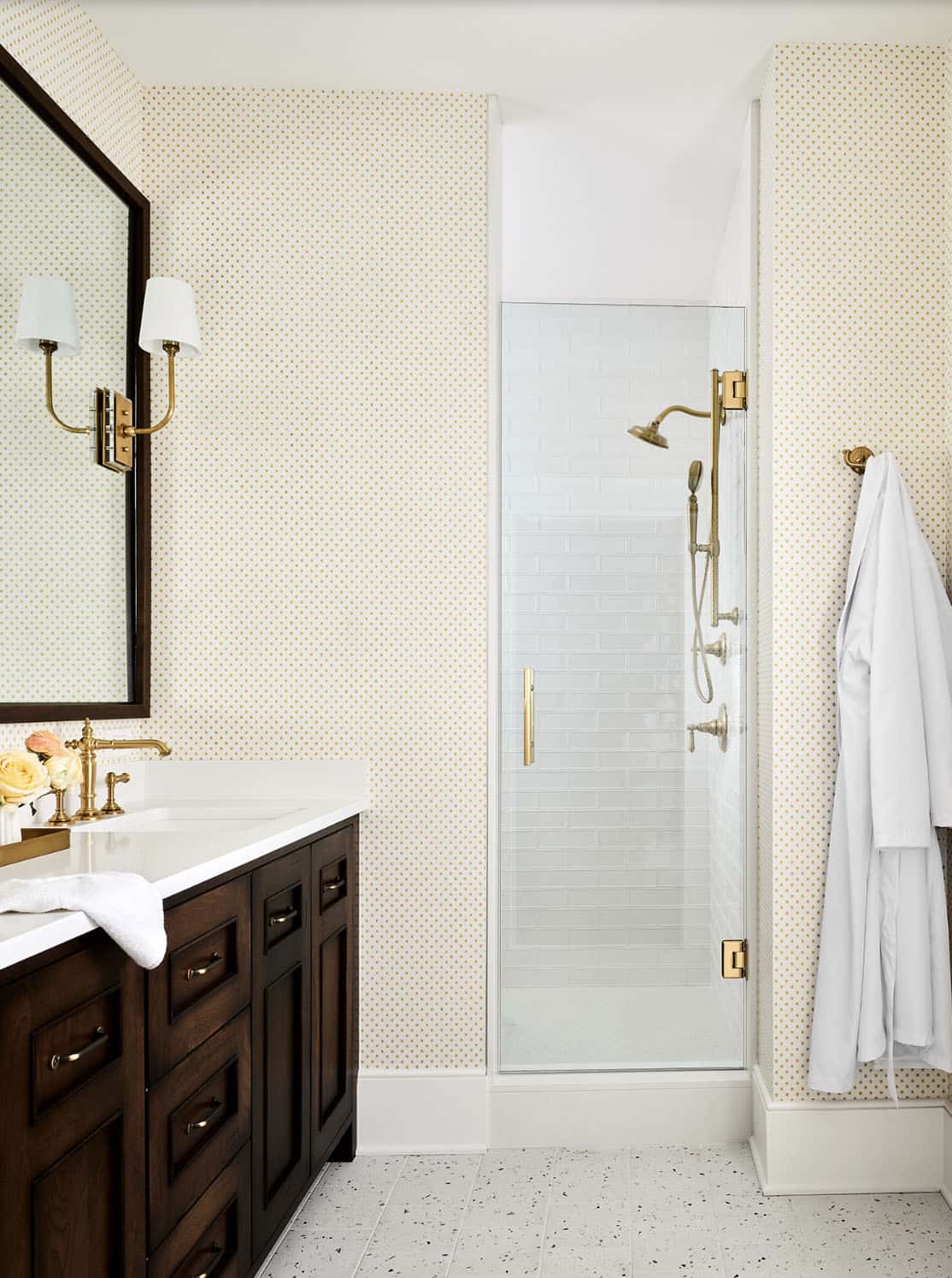 guest bathroom with patterned yellowish-gold wallpaper