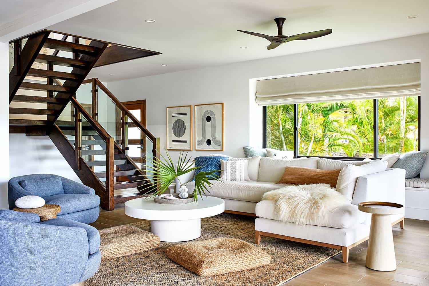 white bungalow living room with exposed stairs