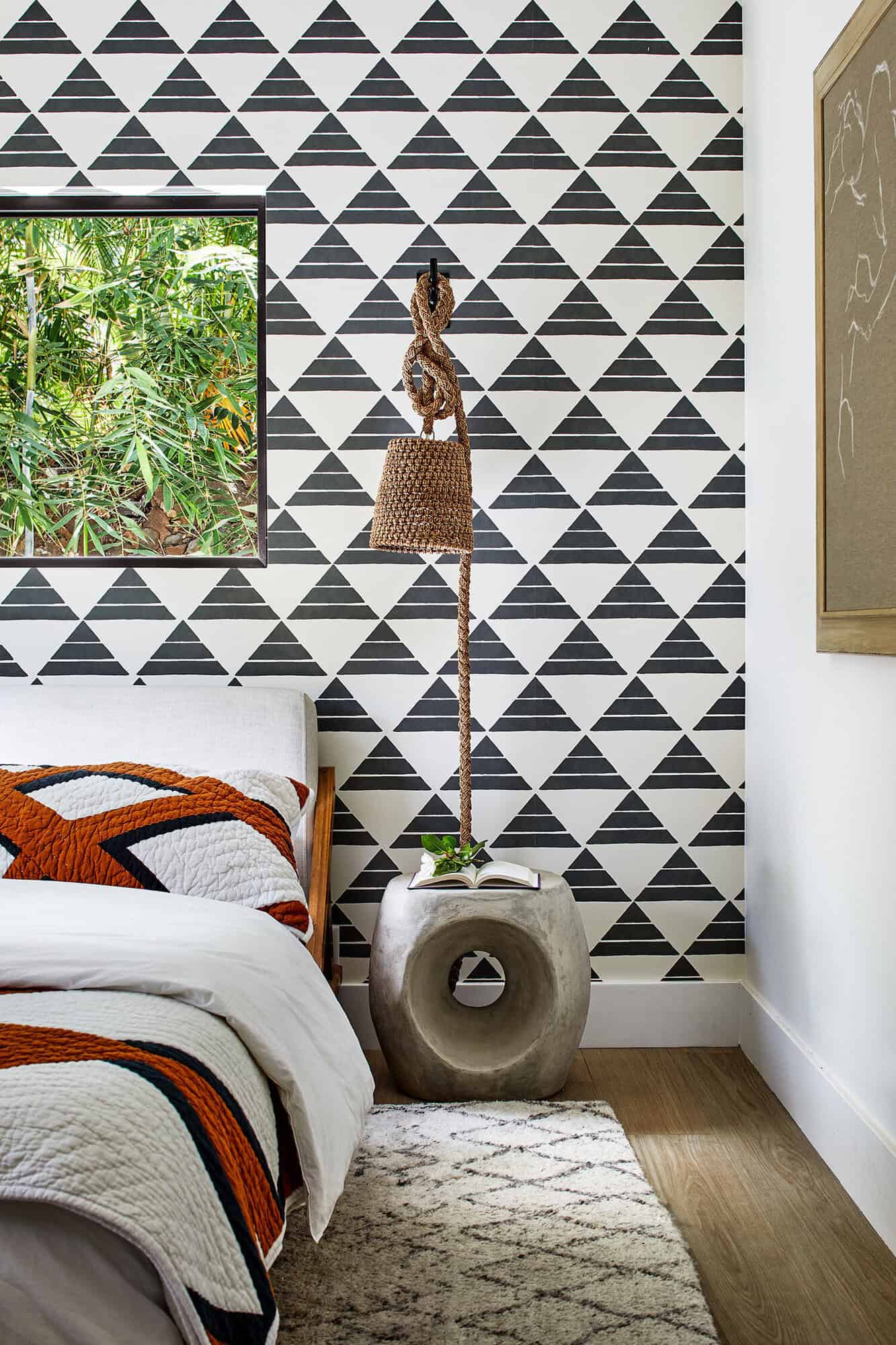 bold bedroom with graphic wallpaper accent wall