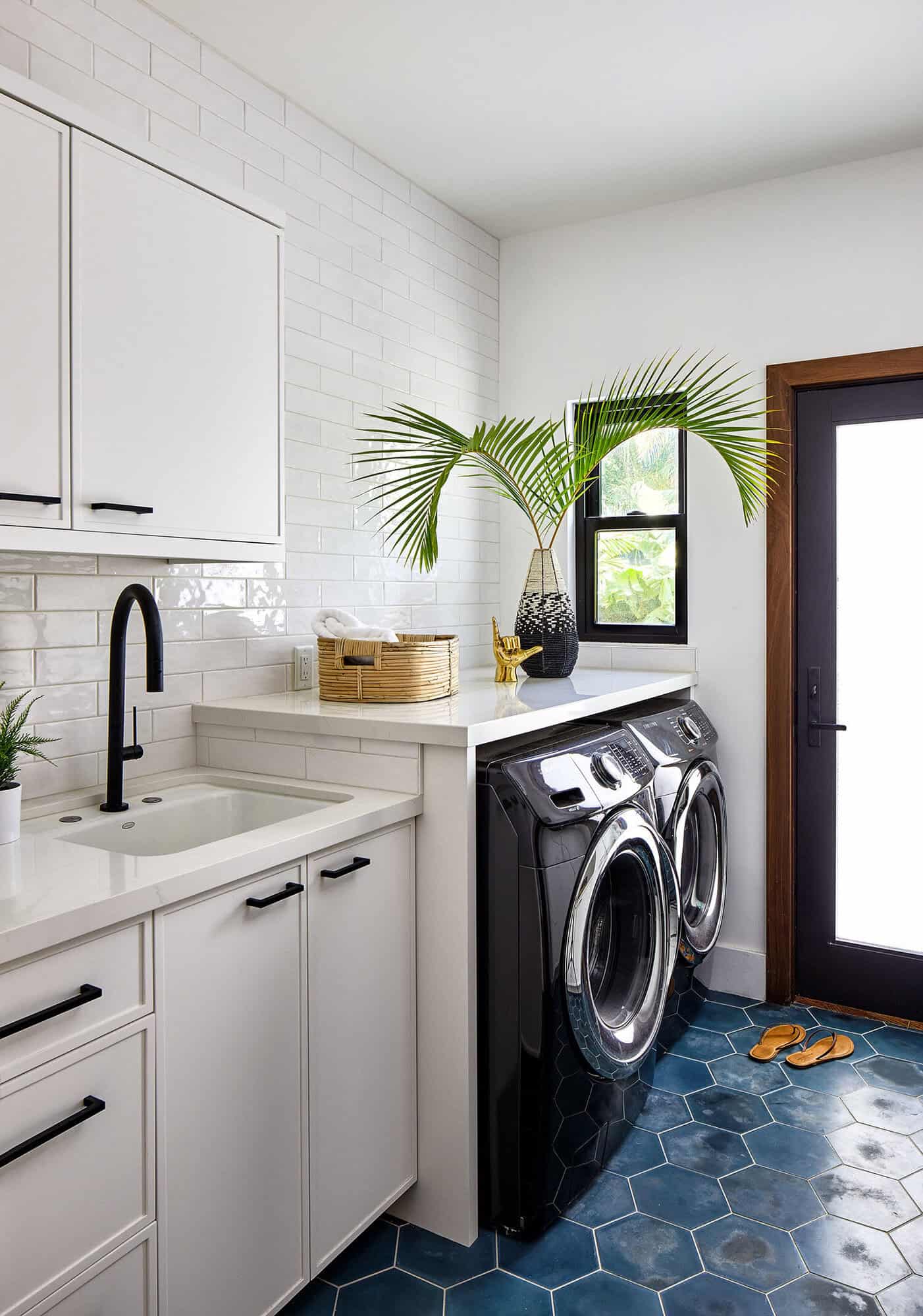 white tropical laundry room with blue tile floor